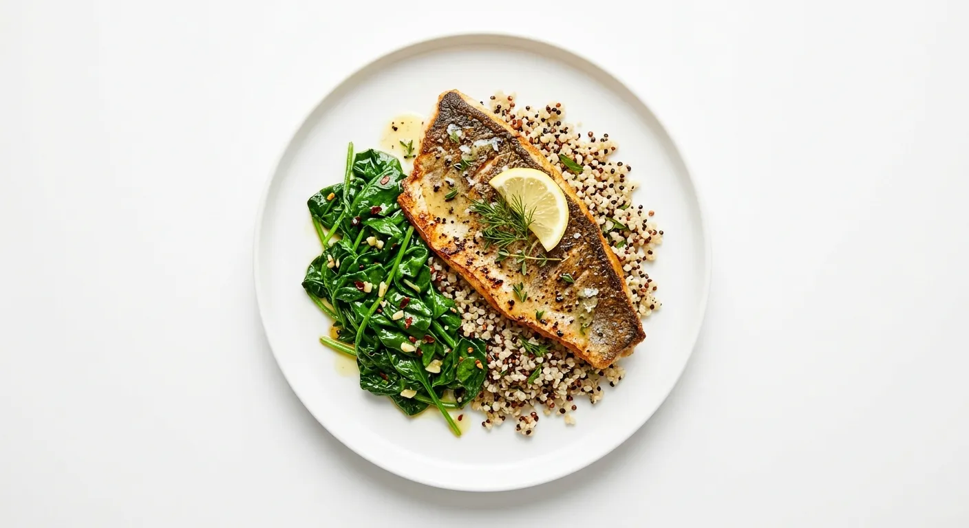 Pan-Seared Sea Bass with Sautéed Spinach and Quinoa